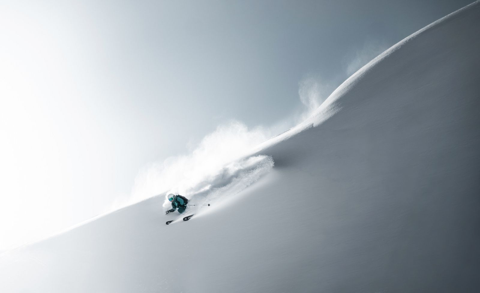 Freerider in deep powder on a steep slope