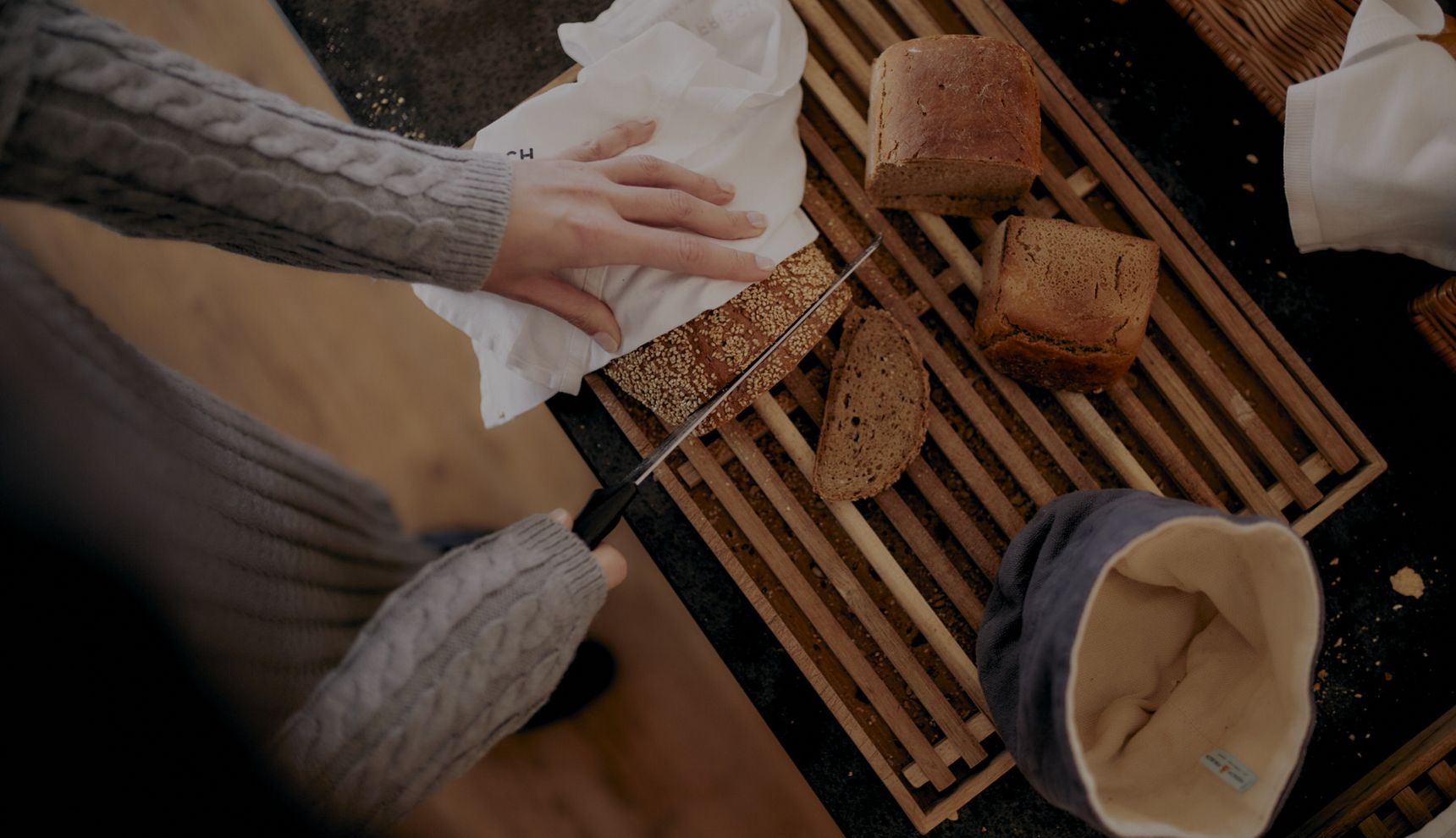 Fresh bread being sliced at the breakfast buffet